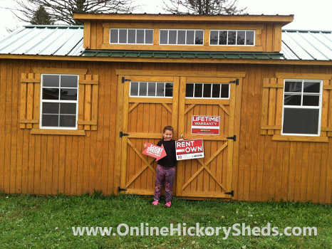 A young girl happy with her new Hickory Shed