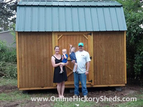A family happy with their new Hickory Shed